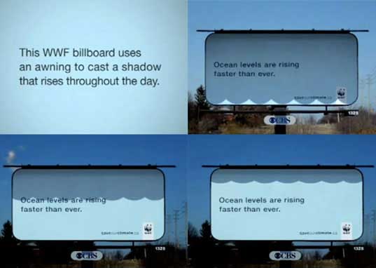 WWF's billboard of ocean levels rising using sunlight and shadows.